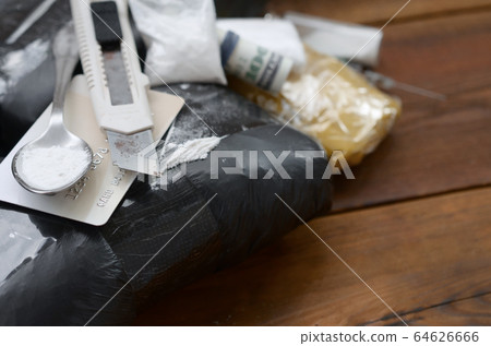 Spoon full of heroin and paper knife lies on drug 64626666