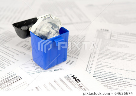 Many american tax blank forms and crumpled hundred Many american tax blank forms and crumpled hundred 64626674