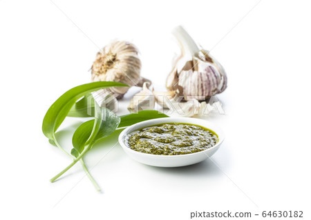 Wild garlic pesto and green ramsons leaves. Wild garlic pesto and green ramsons leaves. 64630182