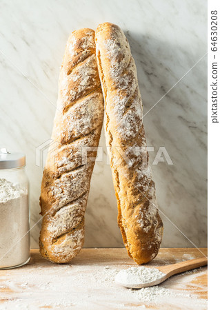 Fresh whole grain bread baguette. Fresh whole grain bread baguette. 64630208