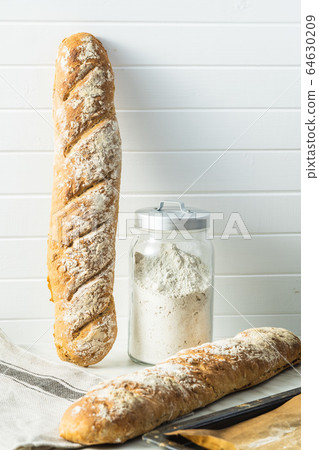 Fresh whole grain bread baguette. Fresh whole grain bread baguette. 64630209