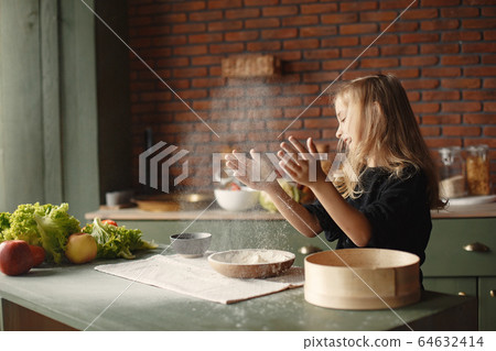 Little girl cook the dough for cookies Little girl cook the dough for cookies 64632414