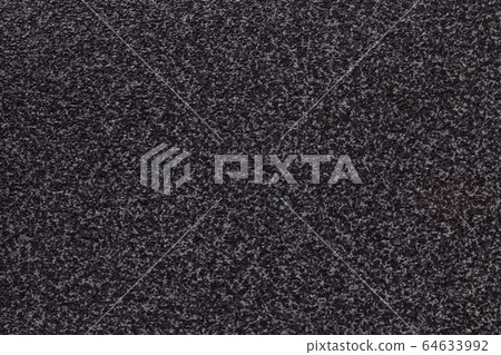 Grainy black background with gray spots. Grainy black background with gray spots. 64633992