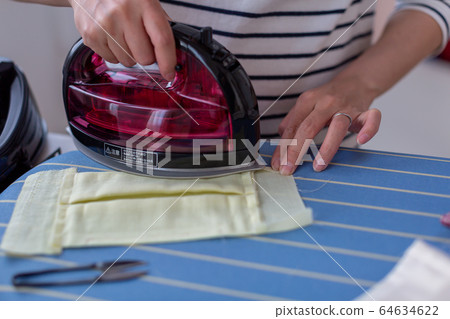 Woman ironing handmade handmade housework Woman ironing handmade handmade housework 64634622