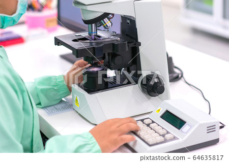 Doctor or scientist and microbiologist with equipment science experiments vacuum tubes for samples Doctor or scientist and microbiologist with equipment science experiments vacuum tubes for samples 64635817