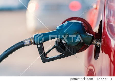 Car refueling on the petrol station with pumping gasoline fuel in car, diesel or gasoline Car refueling on the petrol station with pumping gasoline fuel in car, diesel or gasoline 64635824