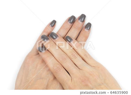 Overgrown shellac nails on female hands on white Overgrown shellac nails on female hands on white 64635900