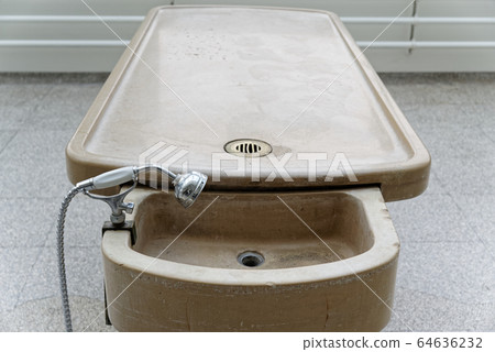 Antique autopsy table in the morgue of a clinic 64636232