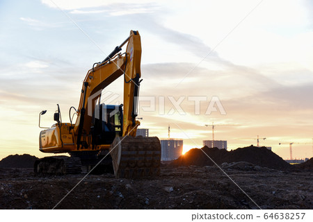 Large tracked excavator at a construction site  64638257