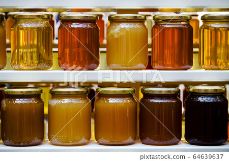 honey jars on a shelf 64639637