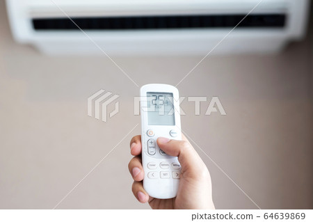 Air conditioner inside the room with close up man Air conditioner inside the room with close up man 64639869