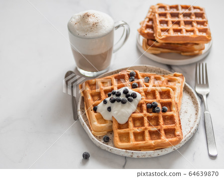 Breakfast belgian waffles, cappuccino. Copy space Breakfast belgian waffles, cappuccino. Copy space 64639870