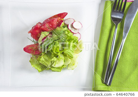 Healthy eating concept. Plate with slices of vegetables Healthy eating concept. Plate with slices of vegetables 64640766