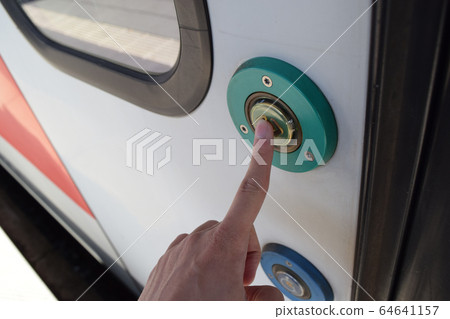 Push the door open / close button of the German railway train 64641157