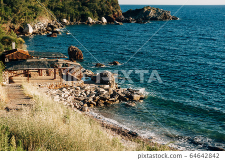 Cafe on a rocky sea shore in Montenegro 64642842