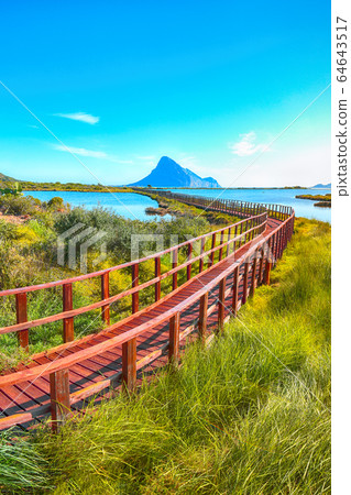 Sunrise from a pedestrian walkway to Porto Taverna 64643517