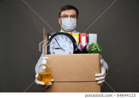 a man dressed as a businessman holds a box with 64644113