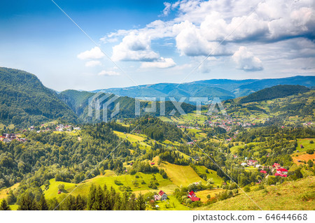 Stunning alpine landscape with green fields and Stunning alpine landscape with green fields and 64644668