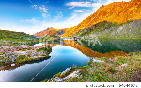 Majestic sunset view of Balea glacier lake near Majestic sunset view of Balea glacier lake near 64644675