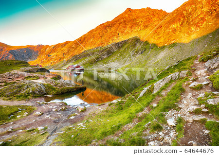Majestic sunset view of Balea glacier lake near Majestic sunset view of Balea glacier lake near 64644676