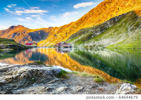 Majestic sunset view of Balea glacier lake near Majestic sunset view of Balea glacier lake near 64644679