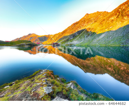 Majestic sunset view of Balea glacier lake near Majestic sunset view of Balea glacier lake near 64644682