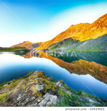 Majestic sunset view of Balea glacier lake near Majestic sunset view of Balea glacier lake near 64644683
