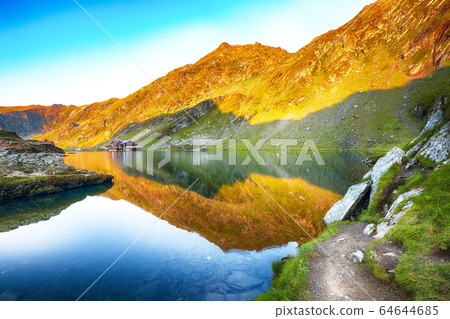 Majestic sunset view of Balea glacier lake near Majestic sunset view of Balea glacier lake near 64644685