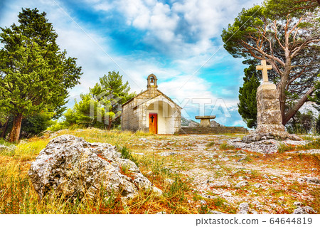 An old baroque church above the mouth of the river 64644819