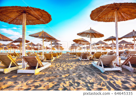 Sun umbrellas and deckchairs on the Copacabana Sun umbrellas and deckchairs on the Copacabana 64645335