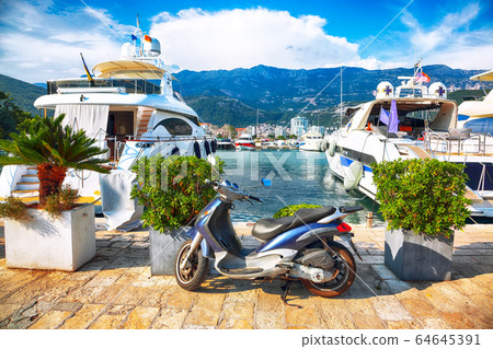 View of waterfront with boats and yachts moored up 64645391