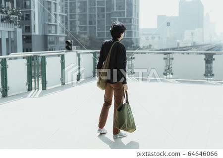Man looking for a sky train. Man looking for a sky train. 64646066