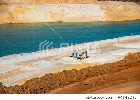 quartz sand quarry with lake 64648283