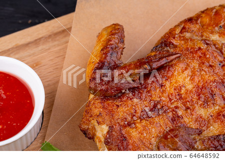 Chicken tobacco fried on coal with garlic, served with greens and ketchup 64648592