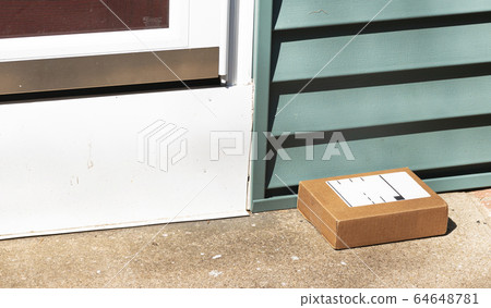 One small package delivered and left on front One small package delivered and left on front 64648781
