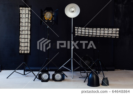 Photo studio flash equipment and accessories of a professional photographer 64648864