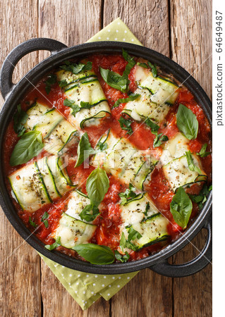Zucchini roll stuffed with ricotta and baked in Zucchini roll stuffed with ricotta and baked in 64649487