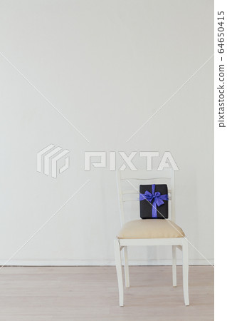chair with birthday present Christmas holiday white chair with birthday present Christmas holiday white 64650415