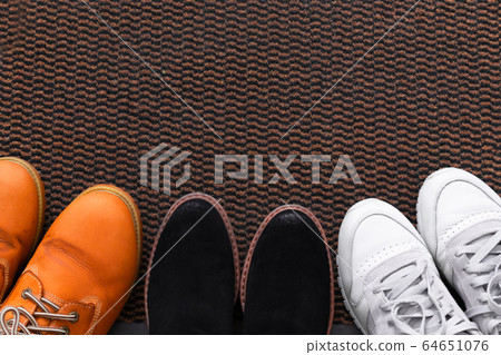 Different men's and women's shoes, pair of Different men's and women's shoes, pair of 64651076