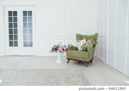 green vintage chair in the interior of the white room green vintage chair in the interior of the white room 64651845