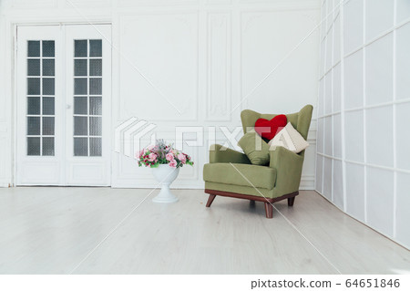 green vintage chair in the interior of the white room 64651846