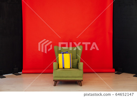 green vintage chair in the interior of the red black room 64652147