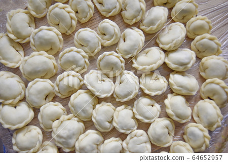 dumplings on the wooden background 64652957