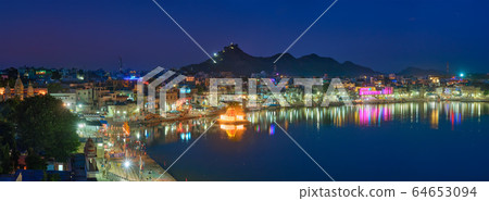View of famous indian sacred holy city Pushkar with Pushkar ghats. Rajasthan, India. Horizontal pan 64653094