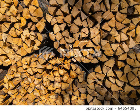 Large supply of stacked firewood Large supply of stacked firewood 64654093