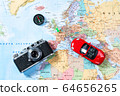 Model of red car, vintage camera and compass lie on Map of Europe 64656265