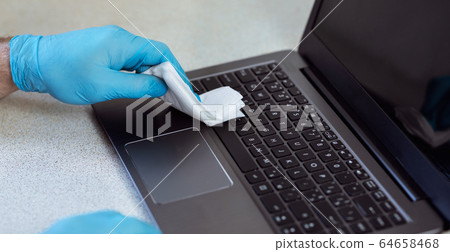 Hands Disinfecting Laptop Wearing Medical Gloves At Home, Closeup, Panorama 64658468