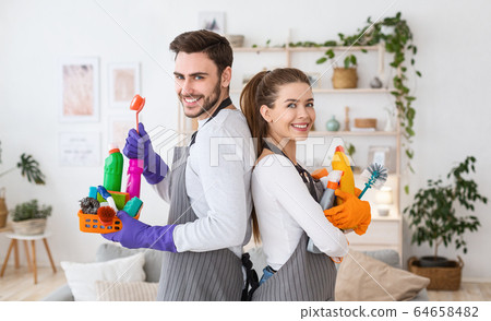 Husband and wife with cleaning supplies at home 64658482