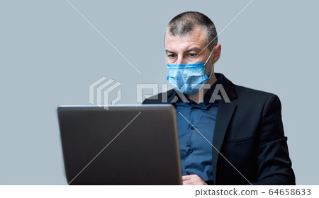 Entrepreneur Working Using Laptop Computer Wearing Protective Mask, Studio Shot Entrepreneur Working Using Laptop Computer Wearing Protective Mask, Studio Shot 64658633