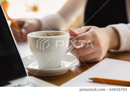 Close up of caucasian female hands, working in office, business, people Close up of caucasian female hands, working in office, business, people 64658769